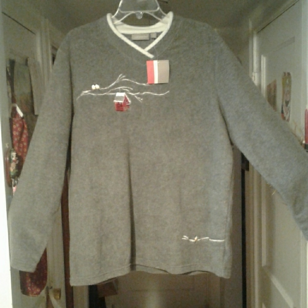 Warm fleece sweatshirt with lovely winter scene.